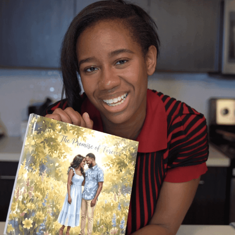 A woman beaming as she holds her personalized Love Tales book